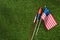 flat lay with american flagpole and fireworks on green grass, americas independence