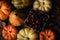 Flat Lay Autumn Still Life with warm side light. An assortment of Fall decorative gourds, squash and pumpkins around a basket of