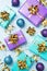 Flat lay background for celebration Christmas and New Year. Gift boxes are purple and turquoise with gold ribbons bows and