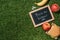 flat lay with blackboard with back to school lettering pieces of chalk banana apples and burger