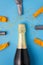 Flat lay of celebration, Champagne bottle and balloon on blue background with glitterà¹ƒ