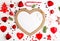 Flat lay Christmas composition with heart, branch, Christmas candy, stripes, Christmas tree, ball, angel, bell and