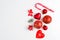 Flat lay Christmas composition with heart, branch, Christmas candy, stripes, Christmas tree, ball, angel, bell and holiday ornamen