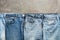 Flat lay collection of fashionable denim blue jeans, border. Top view, flat lay, copy space