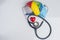 Flat lay colorful brain, heart and stethoscope.