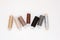 Flat lay colorful cotton thread spools, embroidery yarn, white, brown, gray, black, silver, gold bobbins, mock up, top view.