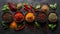 A flat lay of colorful spices and herbs on black background