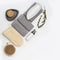 Flat lay composition with bath accessories with bottls with gel or shampoo, soap, washcloth, wooden comb on white