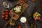 Flat lay composition of bowl of dumplings, jar of sour cream on wooden board