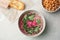 Flat lay composition with bowl of tasty beet hummus, bread and chickpea