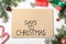 Flat lay composition of card with words Days To Christmas and space for text on white wooden table. Holiday countdown