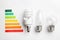 Flat lay composition with colorful chart and lamp bulbs. Energy efficiency concept