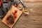 Flat lay composition with delicious grilled meat, oil and vegetables on wooden background