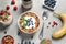 Flat lay composition with delicious yogurt, granola and berries on table, flat lay