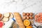 Flat lay composition of different  and space for text on white marble table. Food allergy concept