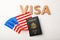 Flat lay composition with flag of USA, passport and word VISA