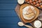 Flat lay composition with freshly baked bread and sourdough on blue wooden table. Space for text