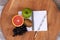 Flat lay composition fruit with notepad on wooden table.