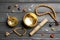 Flat lay composition with golden singing bowl on grey wooden table. Sound healing