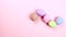 Flat lay composition of Happy Easter holiday concept. Colorful egg in row on pink background. Space for design, top view