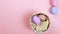 Flat lay composition of Happy Easter holiday concept. Colorful egg in row on pink background. Space for design, top view.