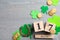 Flat lay composition with horseshoe and block calendar on wooden background, space for text. St. Patrick`s Day celebration