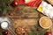 Flat lay composition with ingredients for traditional Christmas cake on wooden table. Space for text