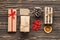 Flat lay Composition from Kraft gift boxes, Dried orange fruits, pine cone, fir branches,  on a brown wooden background