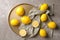 Flat lay composition with lemons, fabric and golden plate