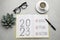 Flat lay composition of notebook with text 2023 Goal, Plan, Action on grey table. New year resolutions