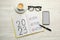 Flat lay composition of notebook with text 2023 Goal, Plan, Action on white wooden table. New year resolutions