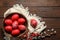 Flat lay composition with painted red Easter eggs on wooden table