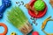 Flat lay composition with pet toys, food and accessories on light blue background