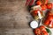 Flat lay composition with pickled tomatoes in glass jars on table