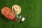 Flat lay composition with picnic basket, wine and strawberries on grass