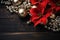 Flat lay composition with poinsettias and glitters, fur, red balls, stars decor on weathered rustic wooden table. Generative Ai
