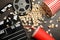 Flat lay composition with popcorn, film reel clapperboard on grey background