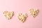 Flat lay composition with popcorn hearts on pink background