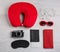 Flat lay composition with red travel pillow on background