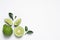Flat lay composition with ripe bergamot fruits on white background. Space for text