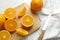 Flat lay composition with ripe oranges, cutting board and knife