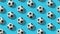 Flat lay composition with set of soccer balls on  light blue background.