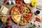 Flat lay composition with slices of delicious pizzas on grey marble table