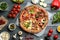 Flat lay composition with slices of delicious pizzas on grey wooden table