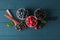 Flat lay composition with small wooden bowls with berries