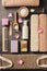 Flat lay composition of some bath accessories on a dark brown rustic background. View from above