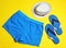 Flat lay composition with stylish male swim trunks. Beach objects