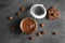 Flat lay composition with tasty chocolate cream in glass jar and hazelnuts