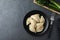 Flat lay composition with tasty dumplings served on grey table