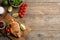 Flat lay composition tasty grilled chicken fillets on wooden table. Space for text